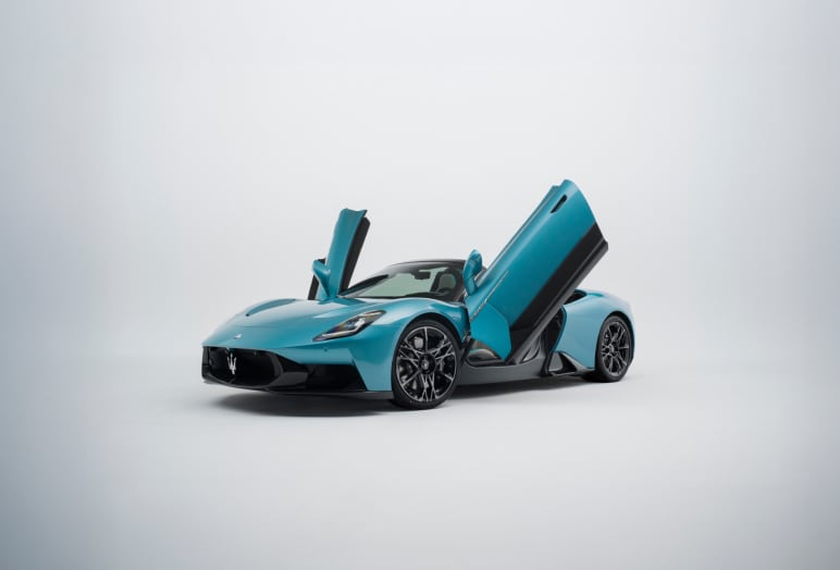 Front angled side view of Maserati MCPURA with doors opened